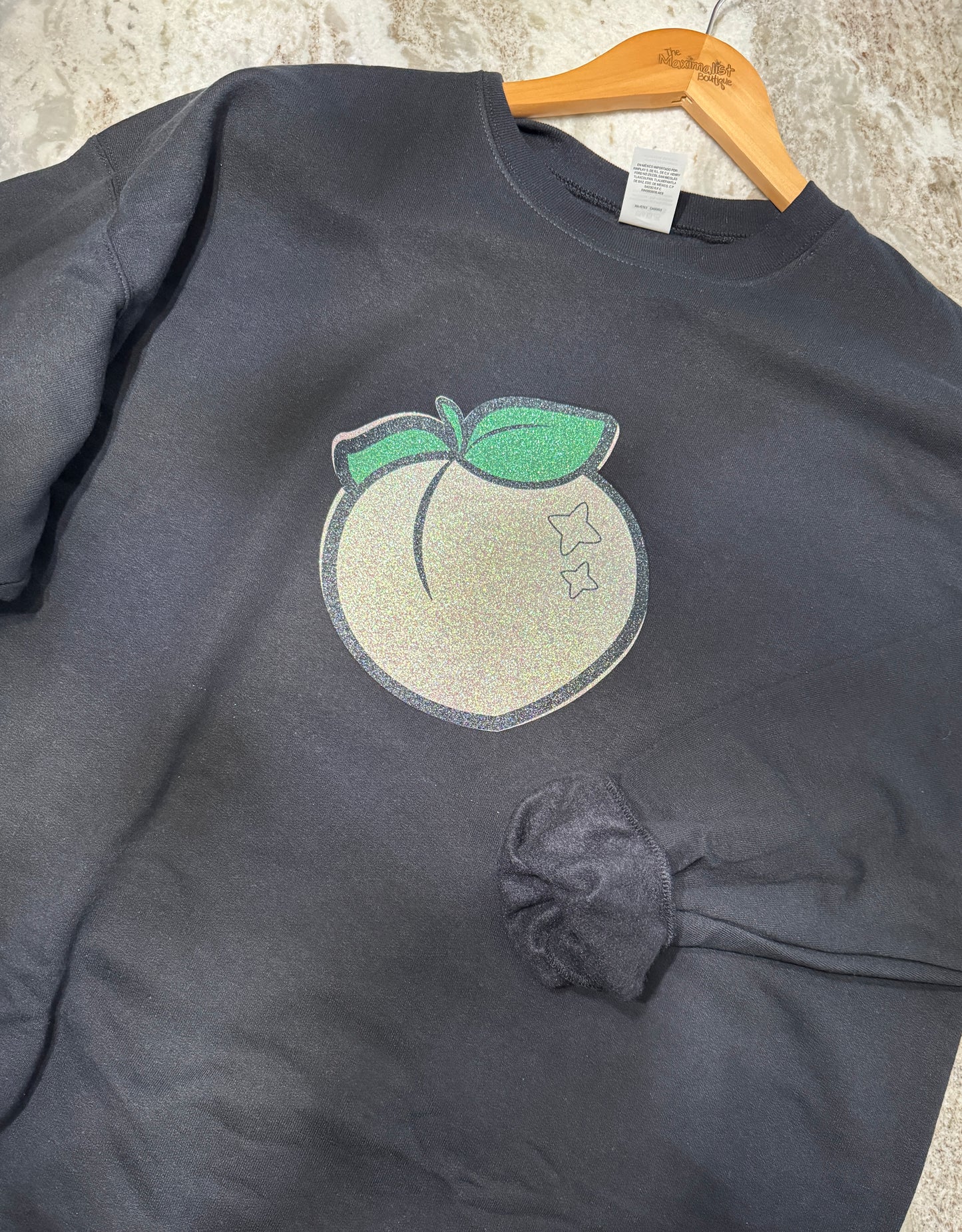 Black Sweatshirt with Glittery Peach Graphic – Sweet, Bold & Chic Sparkle Style