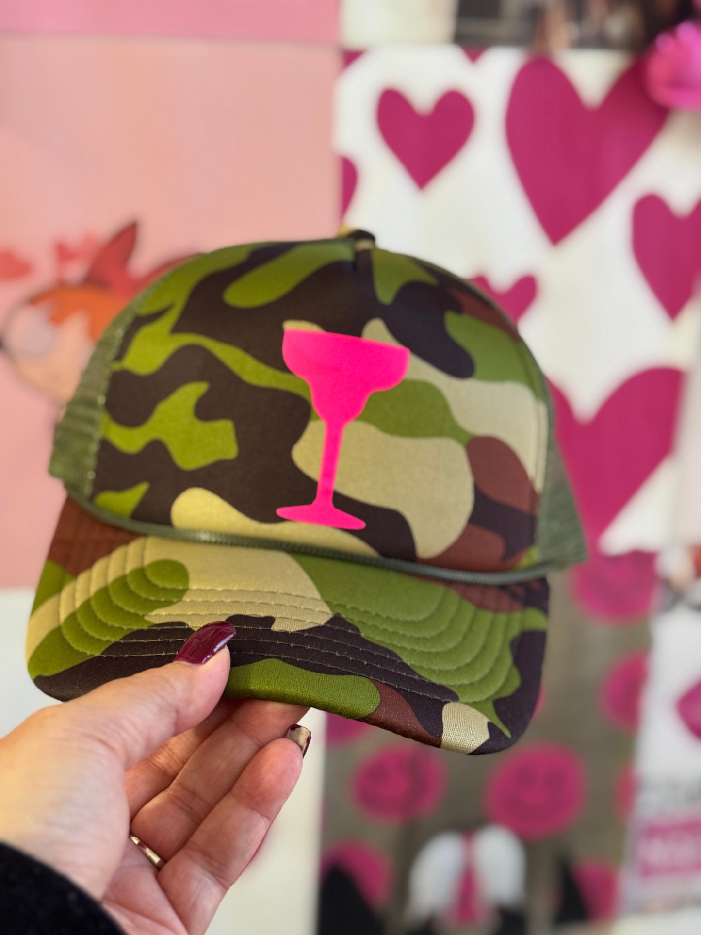 Camo Cocktail Trucker Hat โ Camouflage with Neon Pink Cocktail Glass Graphic