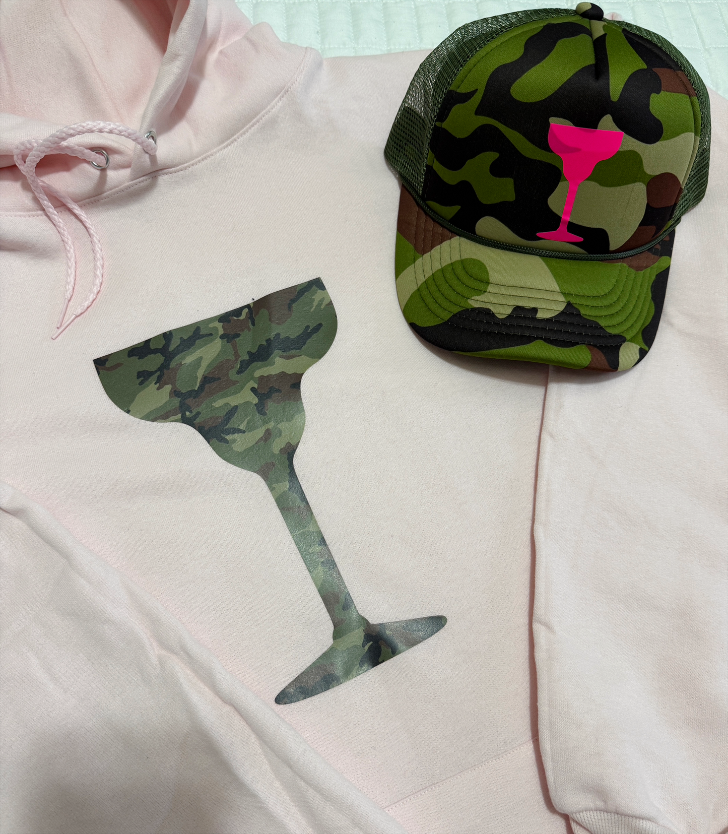 Camo Cocktails Hoodie โ Pale Pink with Green Camo Cocktail Glass Graphic and matching hat