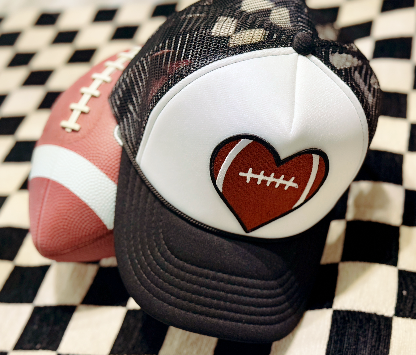 Game Day Chic | Black & White Trucker Hat with Heart-Shaped Football Patch