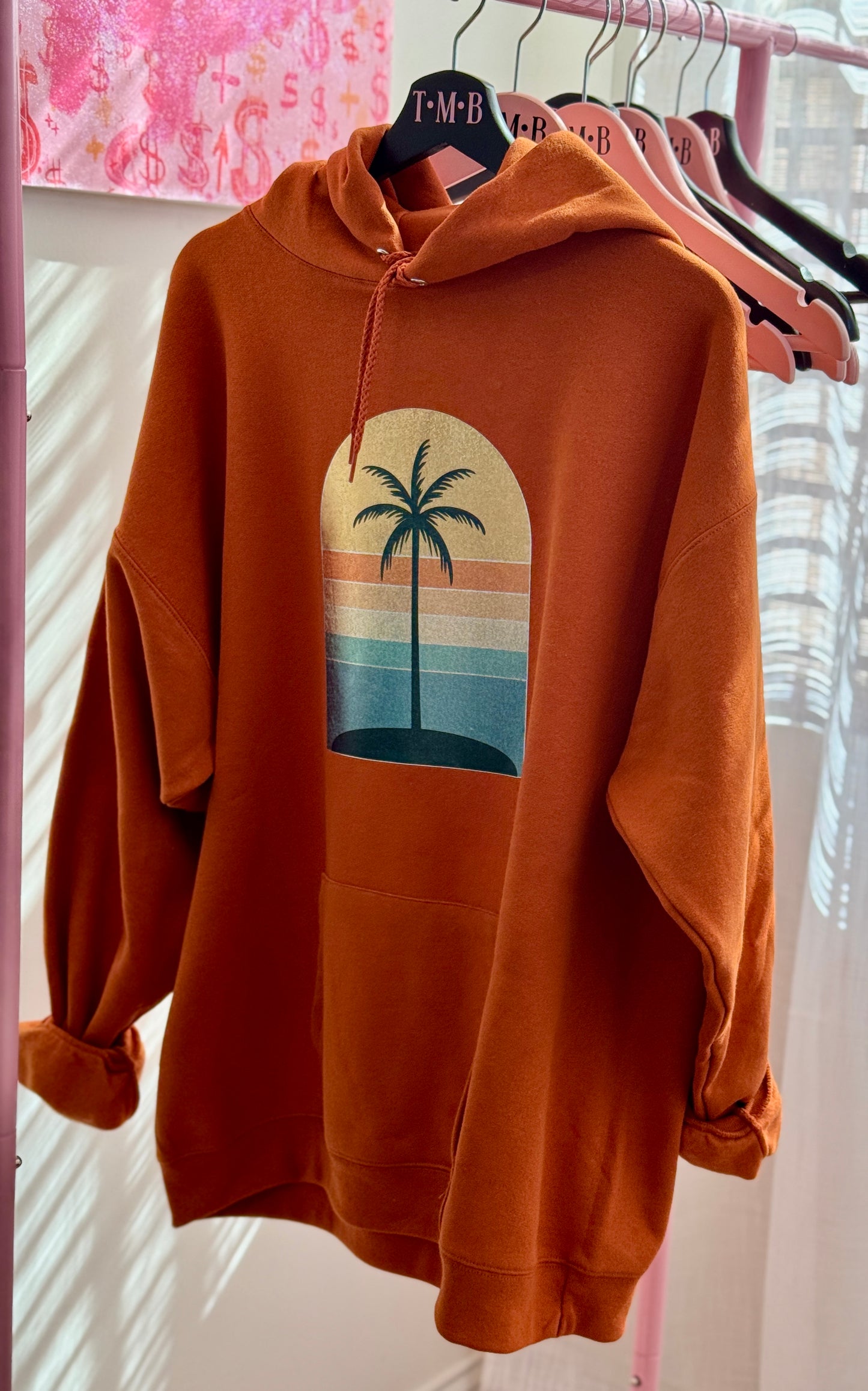 Golden Hour Hoodie – Burnt Orange with Holographic Sunset & Palm Tree Graphic