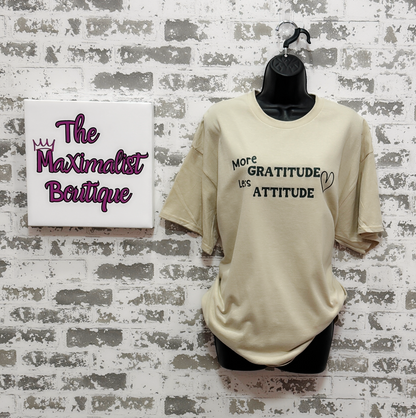 More Gratitude Less Attitude T-Shirt – Sand-Colored Tee with Green Positive Vibes Graphic