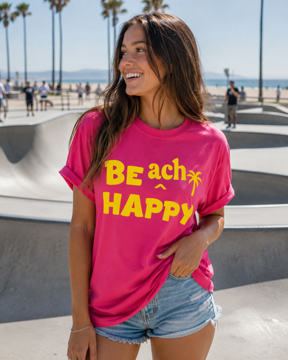 Model wearing a hot pink shirt with bright yellow "BE ach HAPPY" graphic