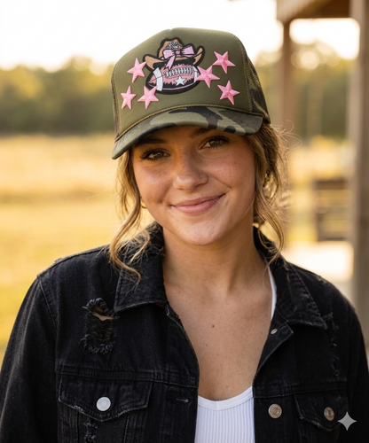Woman wearing a cap with pink star designs outdoors