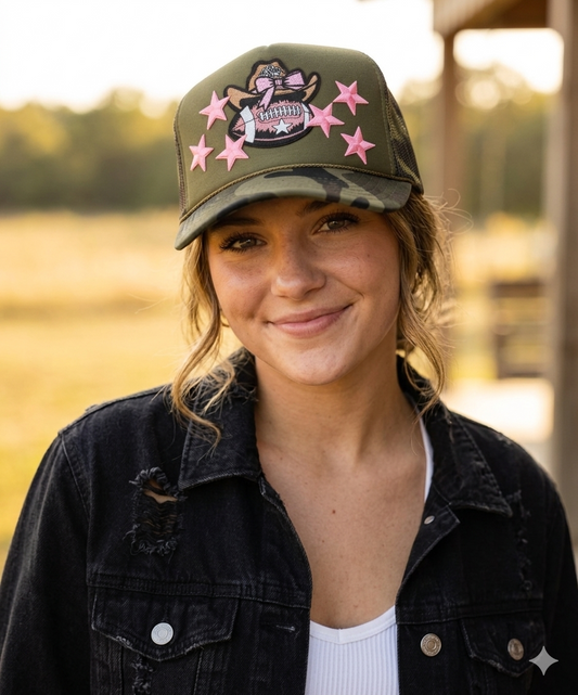 Woman wearing a cap with pink star designs outdoors