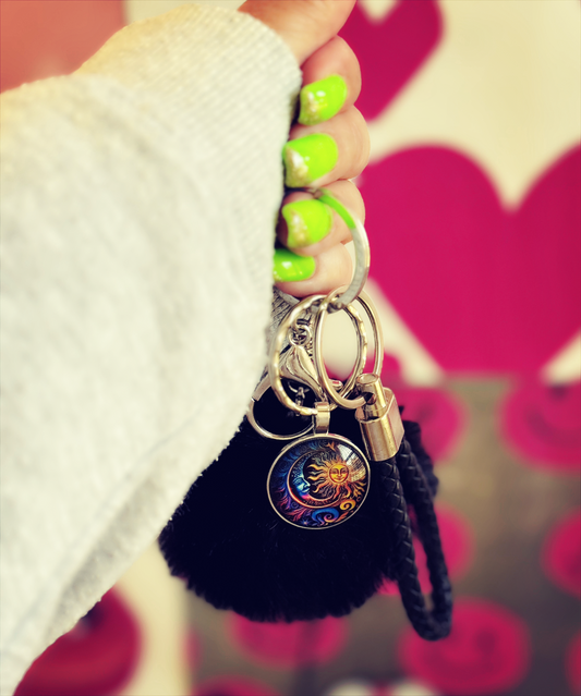 Celestial Charm Keychain – Sun & Moon Design with Black Faux Fur Puff