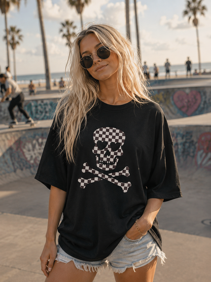 Model wearing a black checkerboard skull graphic tee