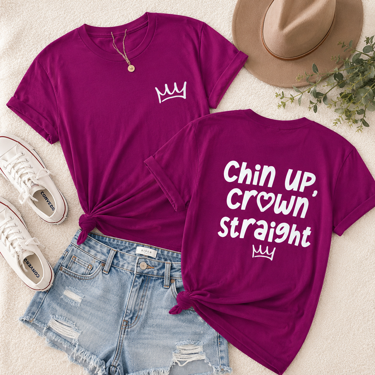 Berry t-shirt with a crown design and text, paired with denim shorts and white sneakers on a light background.