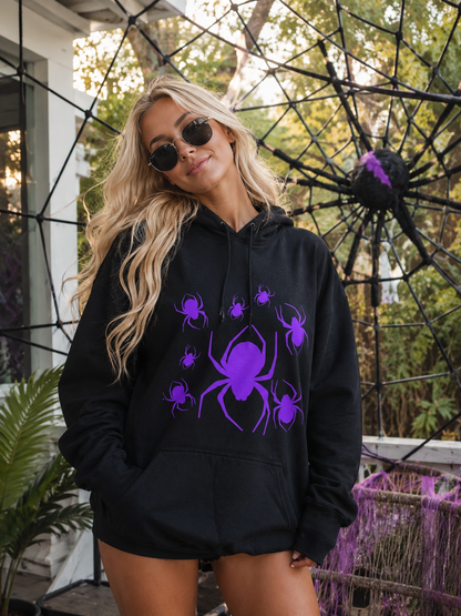 Model wearing a black hoodie with neon purple spiders