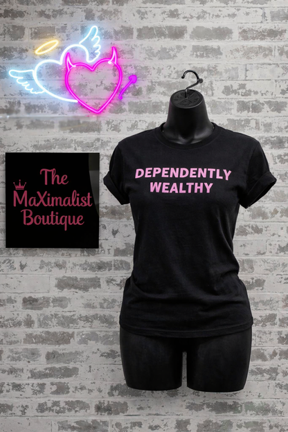 Black t-shirt with 'DEPENDENTLY WEALTHY' text, neon sign, and 'The Maximalist Boutique' sign on a brick wall.