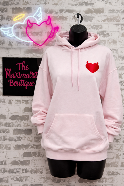 Devilish Hoodie – Light Pink Pullover with Red Heart & Bold Graphic Text