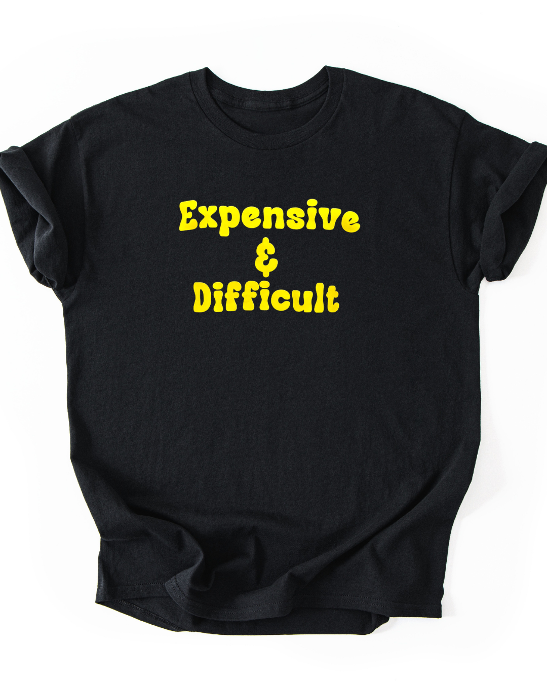 Black t-shirt with yellow text 'Expensive & Difficult' on a white background