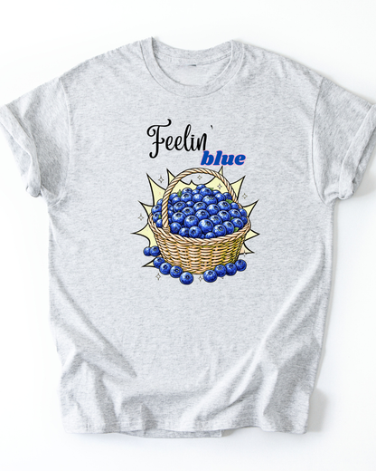 Gray t-shirt with a graphic of blueberries and 'Feelin' blue' text on a white background