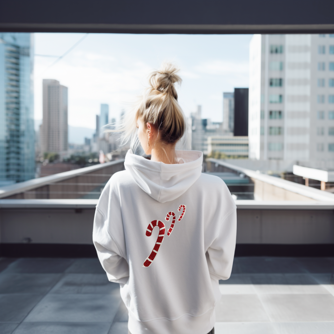 Festive & Cozy | Candy Cane Hoodie in White or Black with Glitter Designs on model