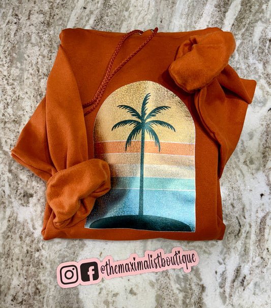 Golden Hour Hoodie – Burnt Orange with Holographic Sunset & Palm Tree Graphic