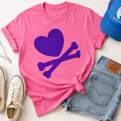 Pink t-shirt with purple heart and bones design, blue cap, denim shorts, and white sneakers on a light background