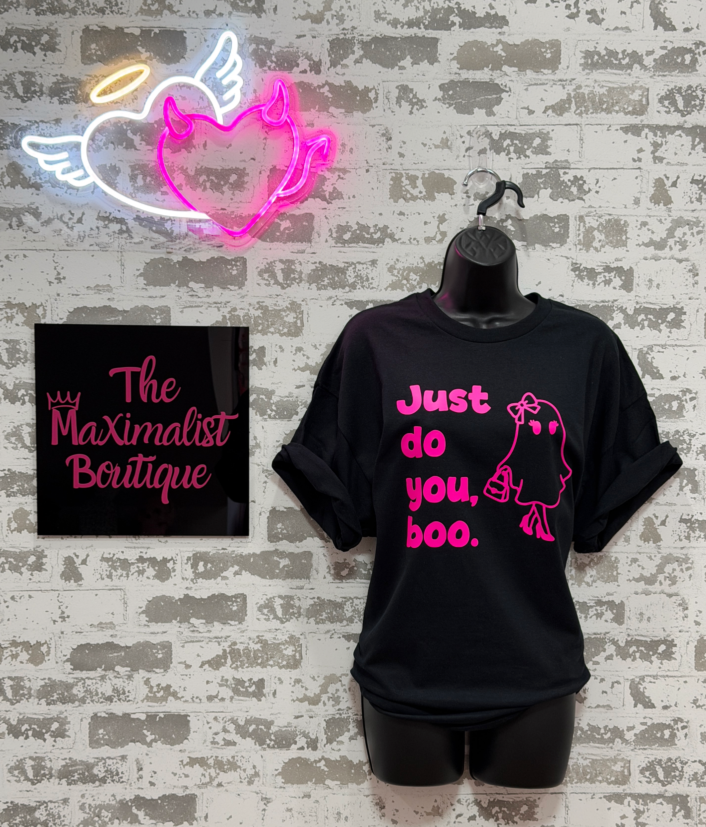 a black tee shirt with "just do you, boo" and a girl ghost in pink. 