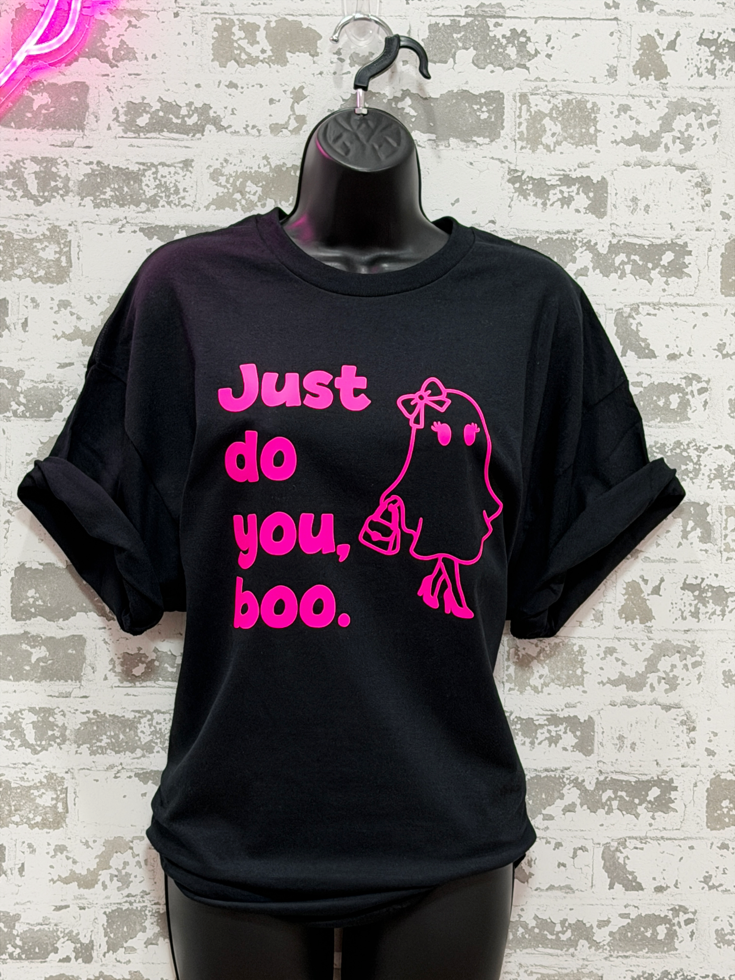 a black tee shirt with "just do you, boo" and a girl ghost in pink. 