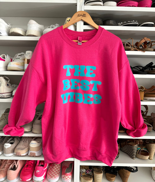 Pink sweatshirt with teal graphic 