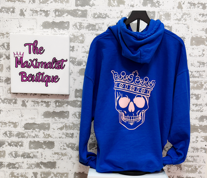 Reign Supreme Hoodie – Royal Blue Pullover with Pink Crowned Skull Graphic for Edgy Regal Style