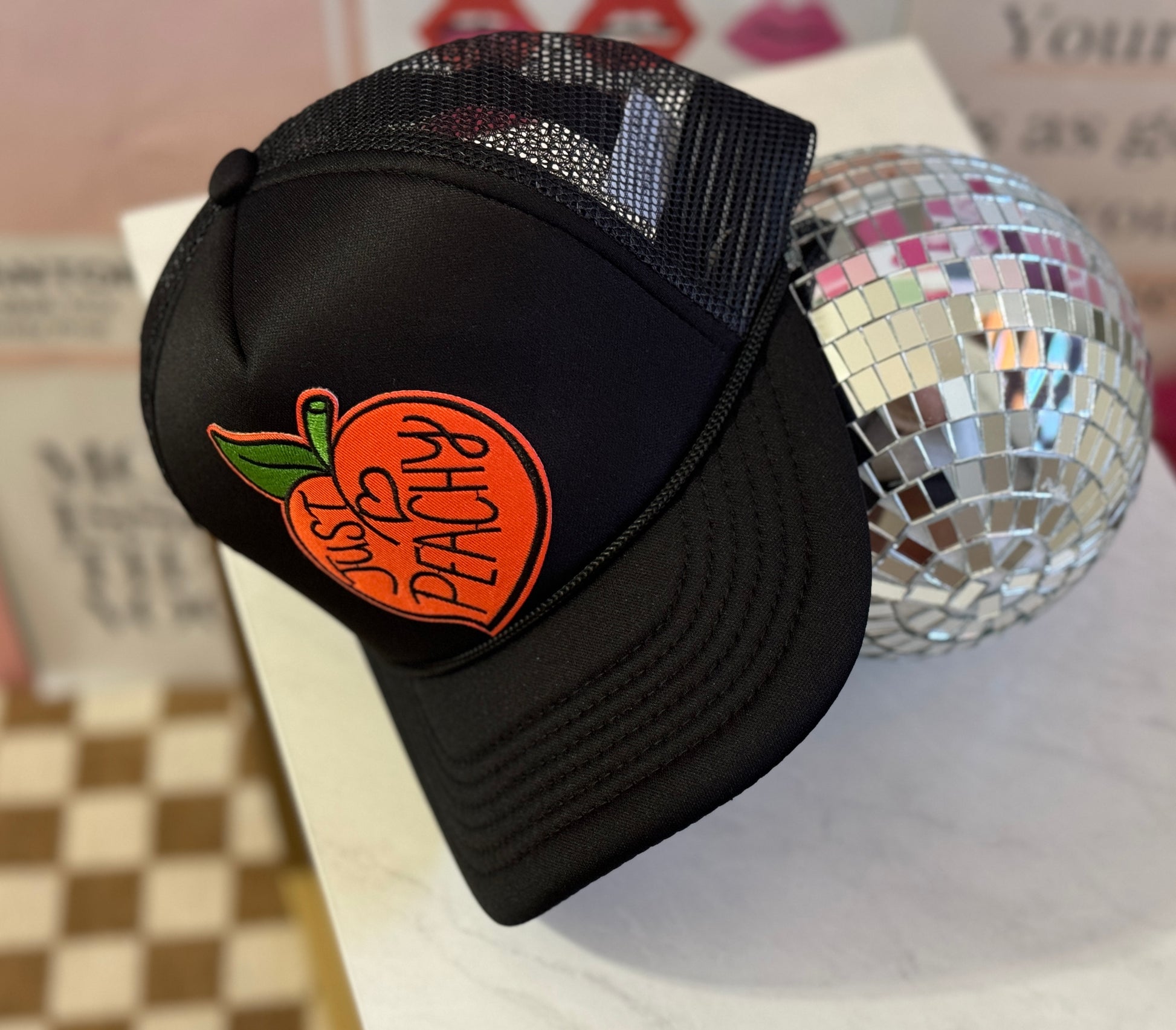 Just Peachy | Black Trucker Hat with Peach Patch for Effortless Style