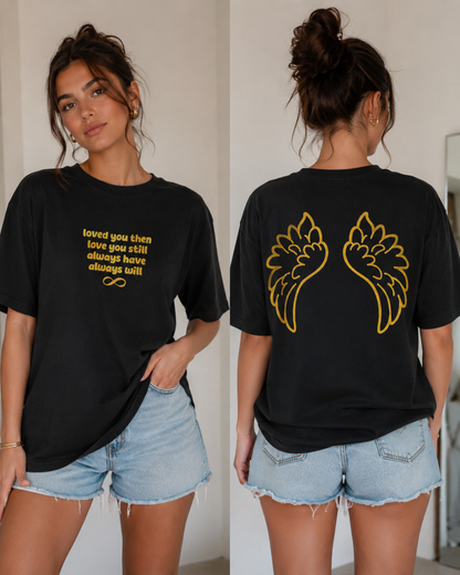 Person wearing a black t-shirt with gold text and designs, shown from front and back.