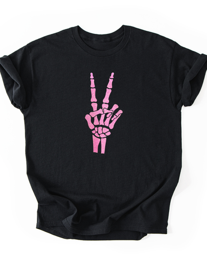 Black t-shirt with pink skeleton hand design on a white background