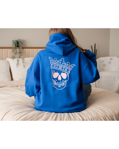 Reign Supreme Hoodie – Royal Blue Pullover with Pink Crowned Skull Graphic for Edgy Regal Style