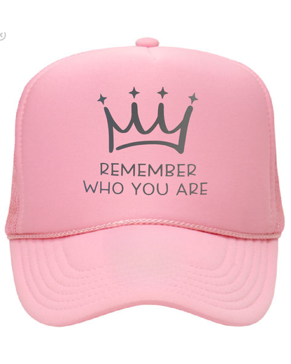 Pink cap with a crown and text design on a white background
