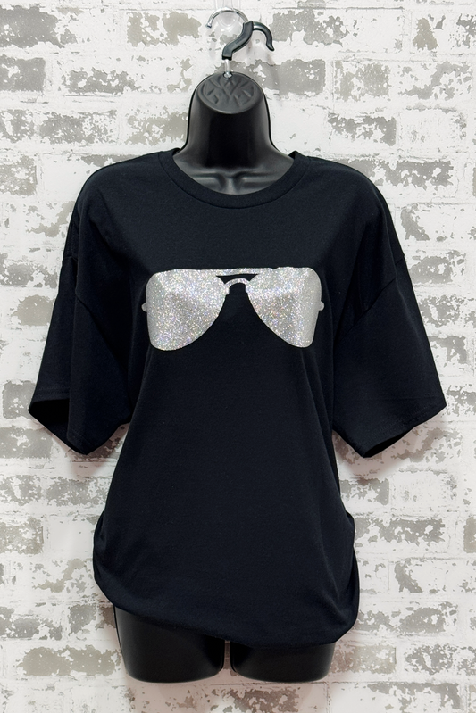 Black t-shirt with silver sequin sunglasses design on a textured white background