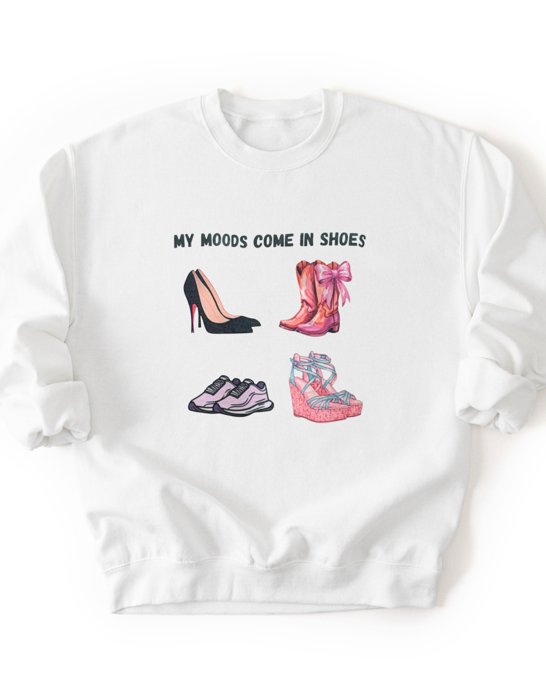 A white crewneck sweatshirt featuring a graphic print of four different pairs of shoes and the text 'MY MOODS COME IN SHOES' in black capital letters.