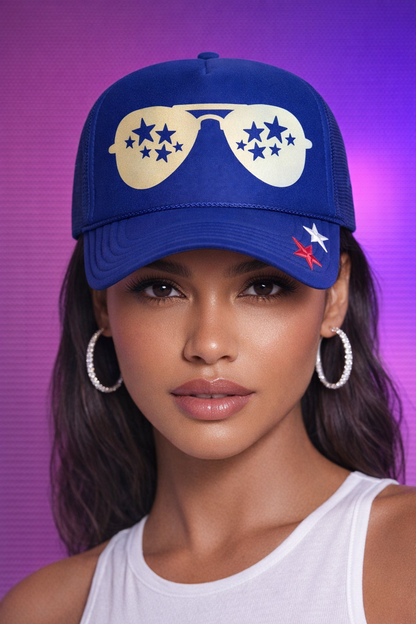 Woman wearing a blue cap with a design on a purple background