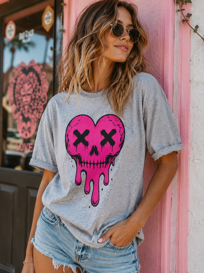 Gray t-shirt with pink skull heart design on a model 