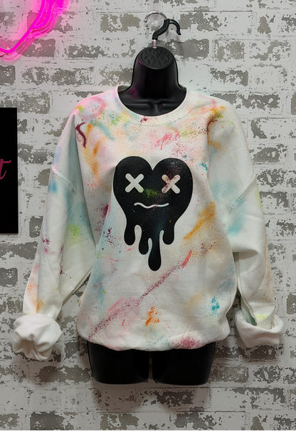 Colorful GRAFFITI sweatshirt with a black heart design on a textured gray background