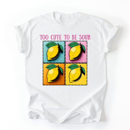 White t-shirt with lemon graphic and text 'Too Cute to be Sour' on a white background