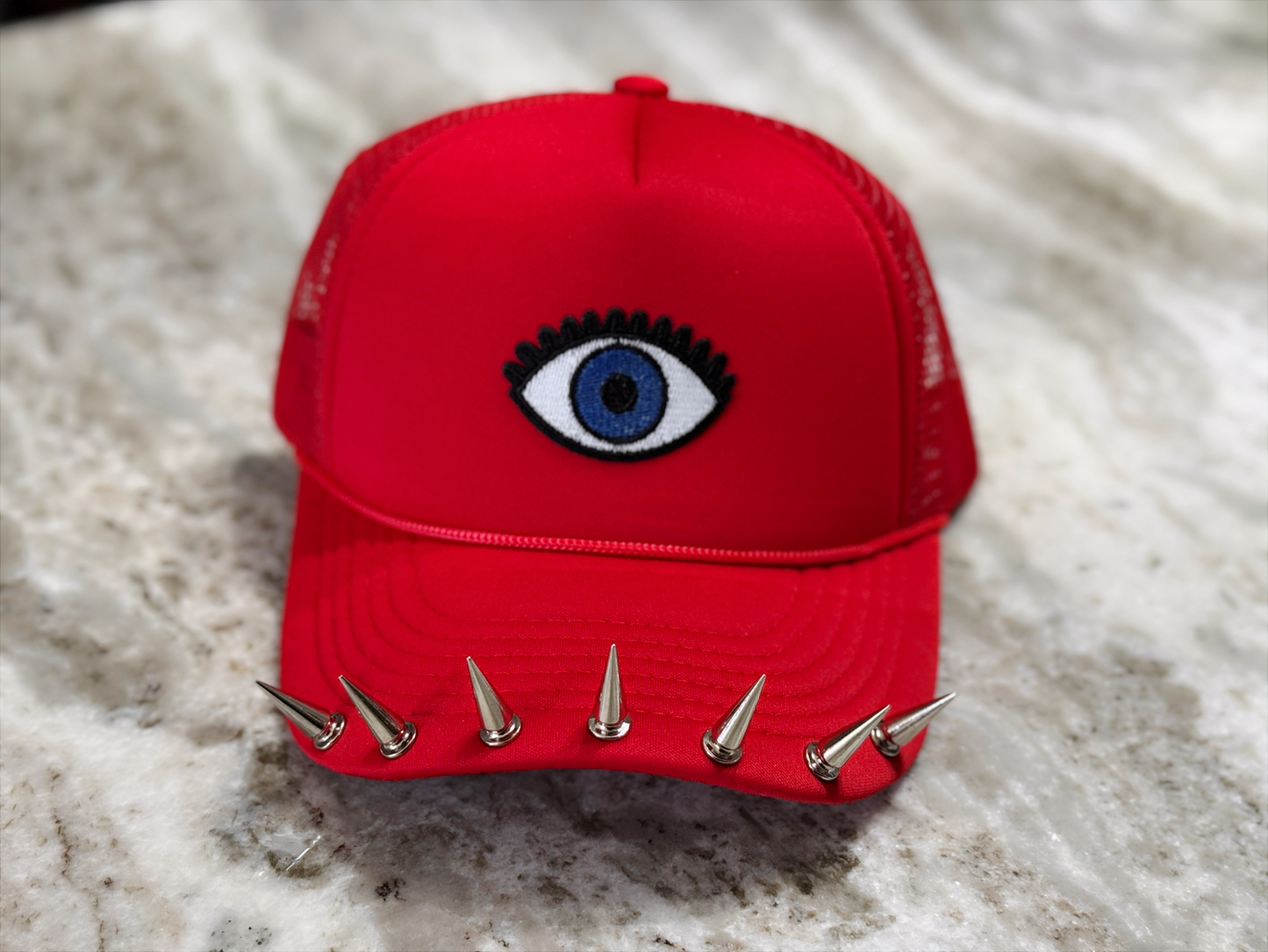 Watchful Edge Trucker Hat – Bold Red with Evil Eye Patch & Silver Spike Brim