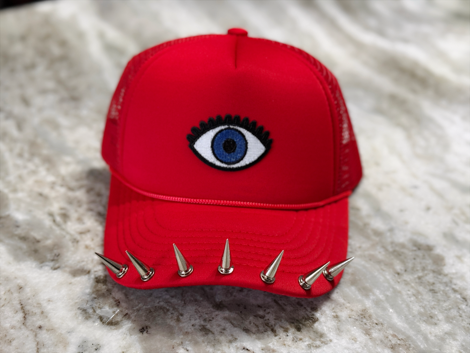 Watchful Edge Trucker Hat – Bold Red with Evil Eye Patch & Silver Spike Brim