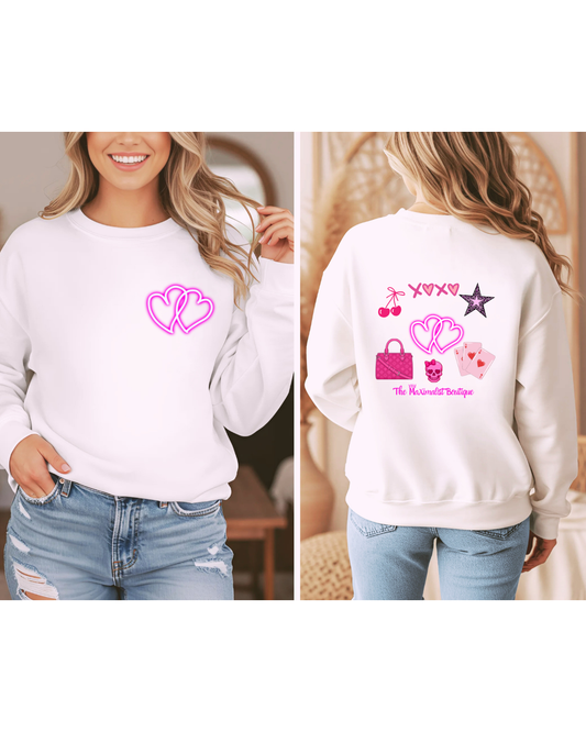 White sweatshirt with pink graphics on a person wearing it, shown from front and back.