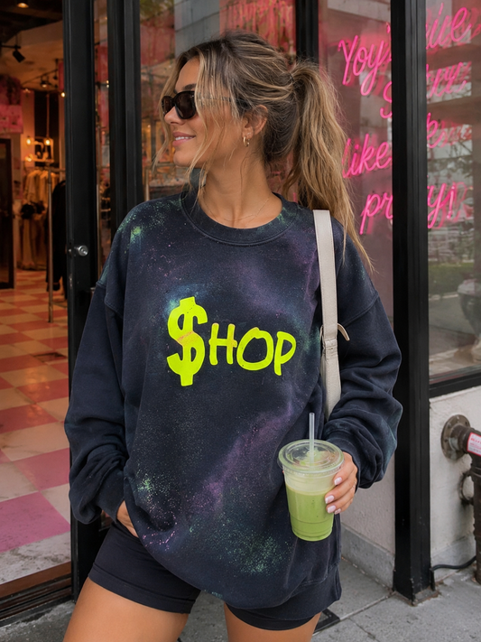Model wearing a black handpainted graffiti sweatshirt with a neon yellow $hop graphic